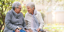 Two Elderly Women Sitting On Bench In Park Smiling Happy Life Long Friends Enjoying Retirement