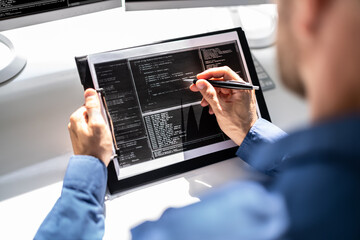 Web Developer Looking At Code