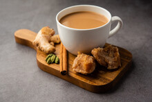 Jaggery Tea Or Gur Ki Chai With Ingredients Like Gud, Ginger Or Adrak, Green Cardamom And Cinnamon