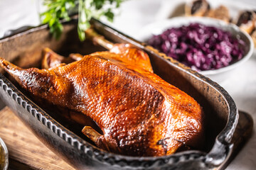 Wall Mural - Crispy baked goose in an original baking dish on the festive table