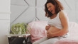 © Valua Vitaly - Expectant mother suffering from pregnant pain. Pregnant woman feeling ache lying on a bad.  Pregnant adult woman feels pain  expecting childbirth. Pregnant woman cannot fall asleep from abdominal pain