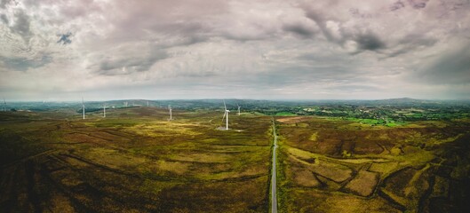 Sticker - Cloudy sky over farm of wind turbines, Ireland