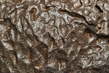 The Metal Meteorite Surface Close-up As Background. Metal Texture.