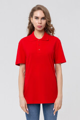 Wall Mural - Front view side of standing female model wearing plan red polo shirt