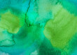 Watery green watercolor full background paper and paint texture wallpaper