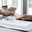 © Puwasit Inyavileart - HR head is reading the resume and information about the candidate's history, Field employers are interviewing job applicants and negotiating agreements, Recruitment and job applications concept.