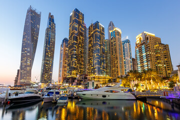 Wall Mural - Dubai Marina skyline yacht harbor architecture travel at night twilight in United Arab Emirates