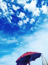 Red Umbrella On Blue Sky
