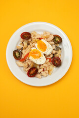 Sticker - Salad with Fried cod fish and white beans on the plate on ceramic.