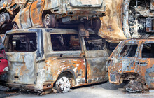 Rusty Burnt Cars Destroyed By Rocket Explosions. War In Ukraine. Destroyed Vehicles Of Civilians Who Were Leaving Were Evacuated From The Combat Zone From Bucha And Irpin. Car Graveyard.
