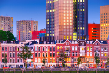 Wall Mural - Rotterdam, Netherlands. View of the city center. Old and modern houses. Panoramic view. Cityscape in the evening. Skyscrapers and buildings.