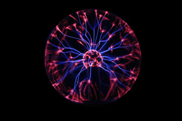 closeup of a plasma globe in the darkness