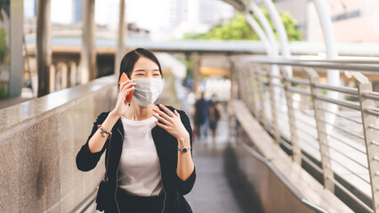 Wall Mural - Young adult asian business single woman use mobile phone talking for contact with customer