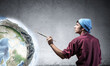 © adam121 - Young artist drawing earth globe