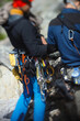 Climbing equipment on the belt climber, abstract blurred image, close-up.