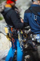 Wall Mural - Climbing equipment on the belt climber, abstract blurred image, close-up.