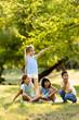 © BGStock72 - Group of asian and caucasian kids having fun in the park