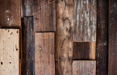 Wooden plank walls of an old house are decayed