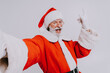 © oneinchpunch - Santa Claus portrait, Christmas and new year's eve festive days concepts - December festive holidays, senior man with beard wearing Santa's costume