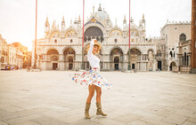 Happy Beautiful Woman Visiting Historic Town Of Venice, Italy - Tourist In Piazza San Marco, Venezia