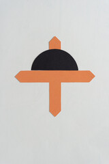 Sticker - orange paper cross with black half circle