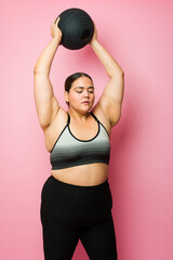 Wall Mural - Plus size woman exercising with cross training to lose weight