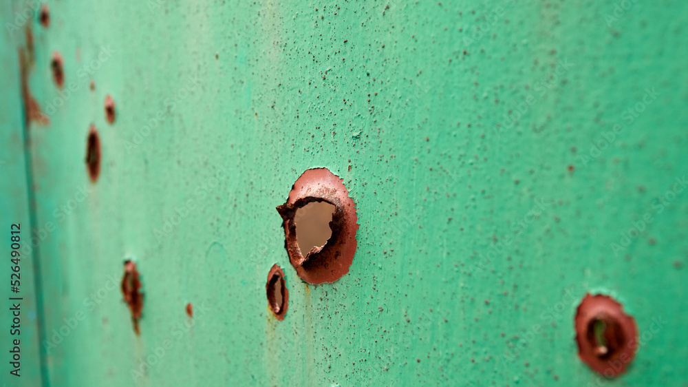 Bullet Riddled Square Gate riddled with bullets. Traces of bullets and fragments of shells ...