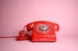 © Jesse - Classic rotary dial telephone in red isolated
