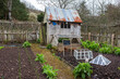 Garden shed, cloches and cold-frame on an allotment in Devon, UK