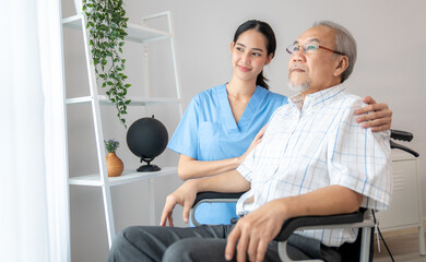 Wall Mural - Caring nurse and a contented senior man in a wheel chair at home, nursing house. Medical for elderly patient, home care for pensioners.