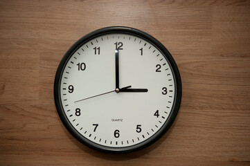 Poster - office wall clock indicating the three o clock hour