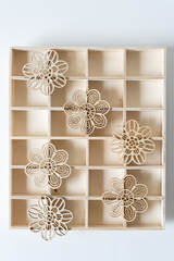 Wall Mural - floral wooden ornaments on a shallow wood box with many compartments