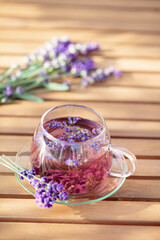 Wall Mural - Glass cup of lavender tea.