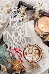 Wall Mural - Hot chocolate with marshmallow on wool background. Christmas concept