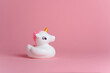 Close-up unicorn on pink copy space