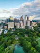 © Johnathan Freeman/Wirestock Creators - Vertical drone view of the Downtown Atlanta with modern buildings and a large green park, Georgia