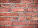 Fototapeta  - Red brick background closeup for background or conceptual use.