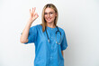 © luismolinero - Young surgeon doctor woman isolated on white background showing ok sign with fingers