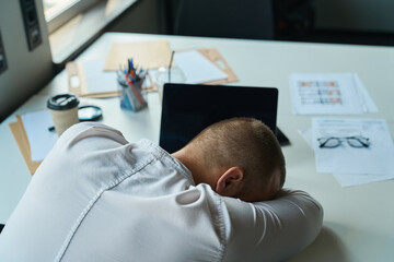 Exhausted consultant fell asleep at the workplace