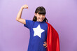 © luismolinero - Little kid isolated on purple background in superhero costume and doing strong gesture