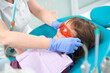 © Svitlana - Pedodontist protecting little girl eyes before dental procedure