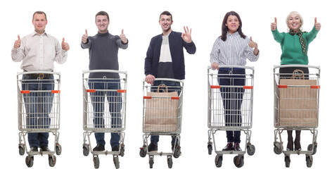 group of people with shopping cart showing thumbs up