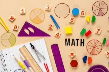 Wall Mural - Wooden toy blocks. School supplies, math fractions, pencils, numbers, on beige background. Back to school, education concept background	