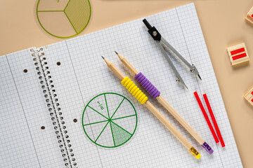 Wall Mural - set of tools for drawing. School supplies, math fractions, pencils, numbers, notepad on beige background. Back to school, education concept background
