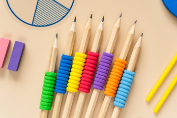 Wall Mural - School supplies, math fractions, pencils, numbers, notepad on beige background. Back to school, education concept background. close up