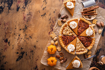 Wall Mural - Traditional fall Thanksgiving pie slices, pumpkin and pecan pie