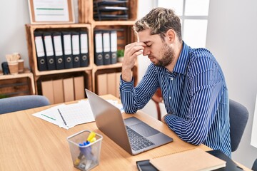 Young man business worker stressed using laptop at office