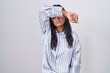 © Krakenimages.com - Young hispanic woman wearing glasses covering eyes with arm, looking serious and sad. sightless, hiding and rejection concept