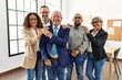 © Krakenimages.com - Group of middle age business workers smiling happy standing at the office