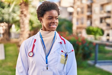 Sticker - African american woman wearing doctor uniform standing at park